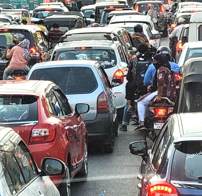 A road with heavy traffic congestion in Pune