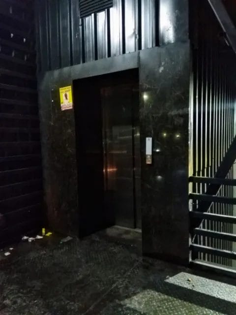 dark, dingy and water logged approach to the elevators 