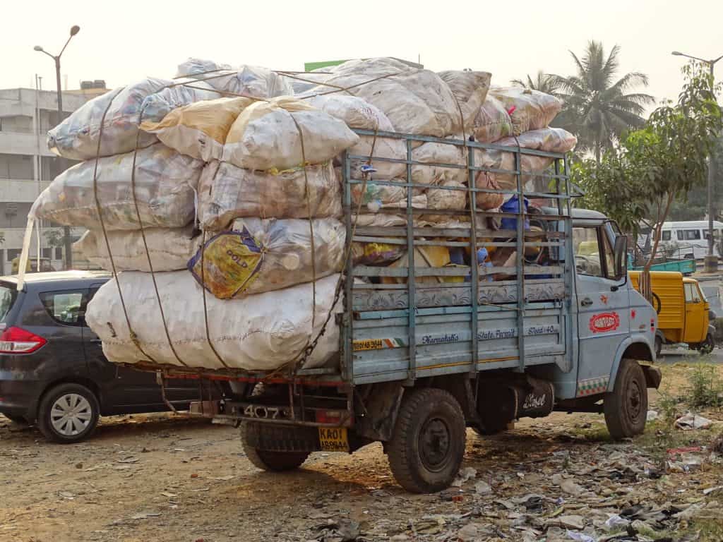 Dry waste Truck loaded with bags of recyclables  