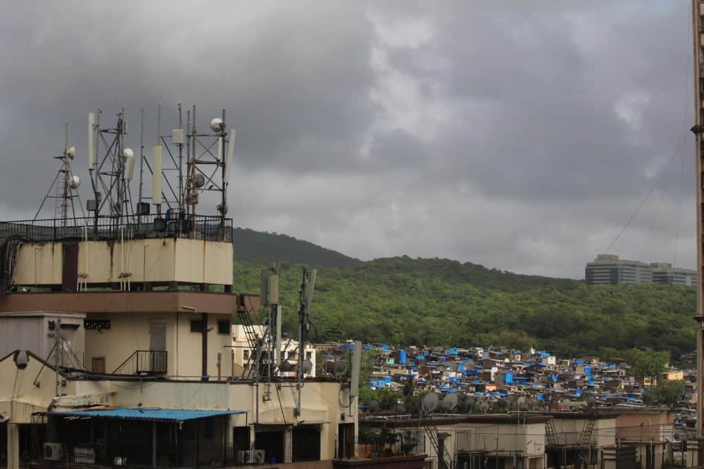 view of antennae, shanties and hills in Mumbai