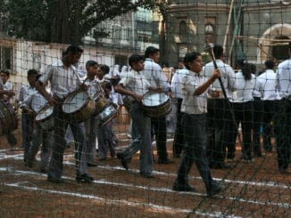 a group of children in a marching band in a mumbai school