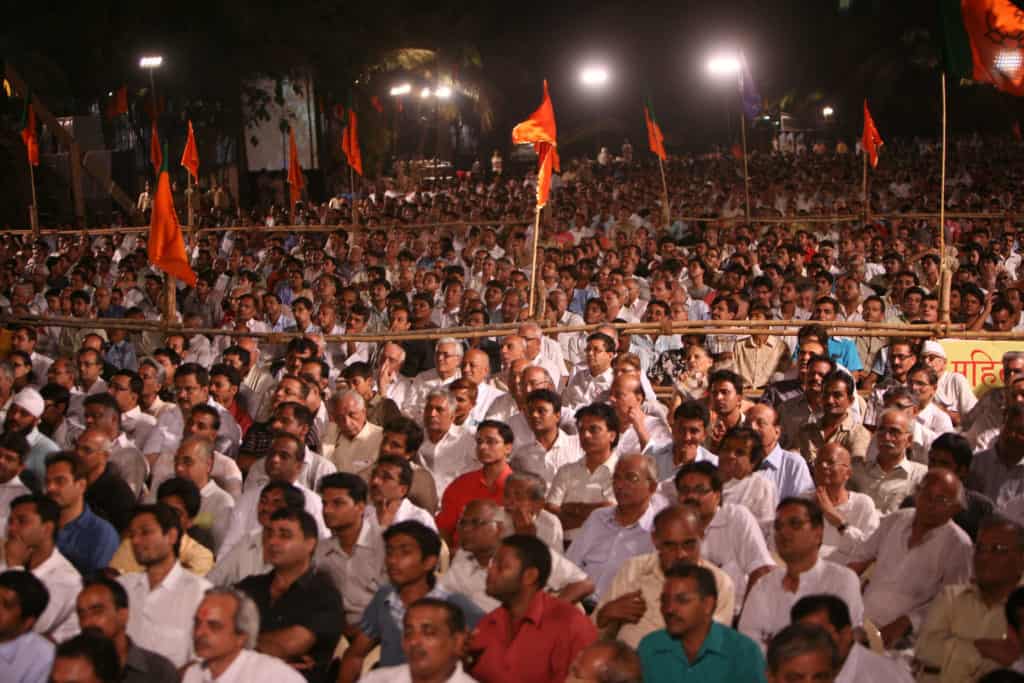 a crowd of men at a BJP rally for elections in Mumbai
