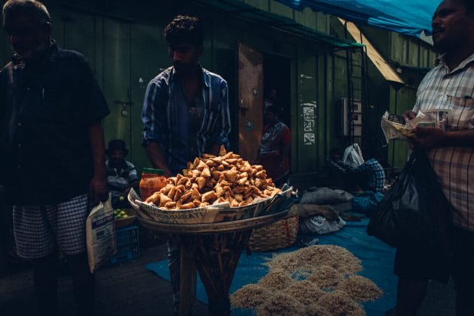 Street vendor selling samosas.  Source: MS Gopal, Mumbai Paused