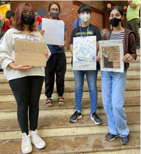 Fridays for Future volunteers with posters raising awareness about climate change
