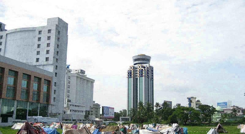 Urban rich poor divide: Slums next to high-rise commercial buildings